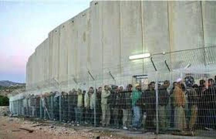 13. Palestinians along the wall.jpeg