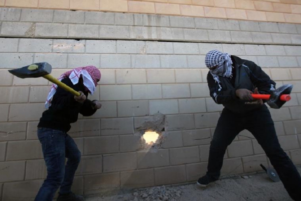 8. Palestinians breaking wall through Westbank.JPG